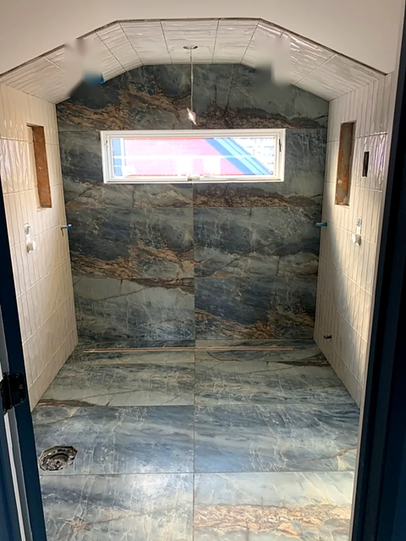 Blue-veined slab under a barrel ceiling