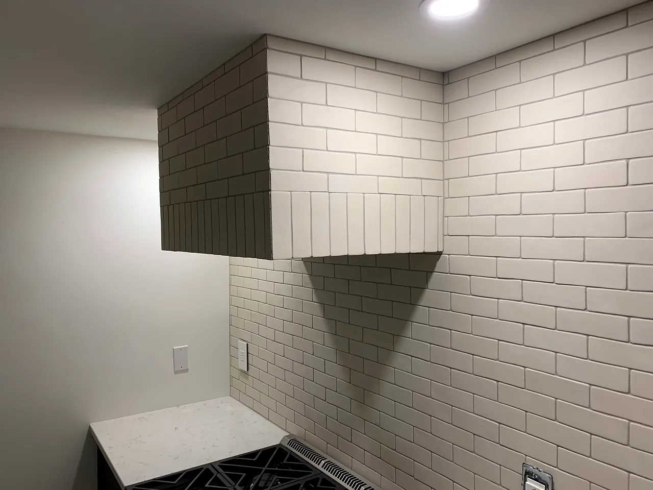 Handmade-look brick with a tiled hood
