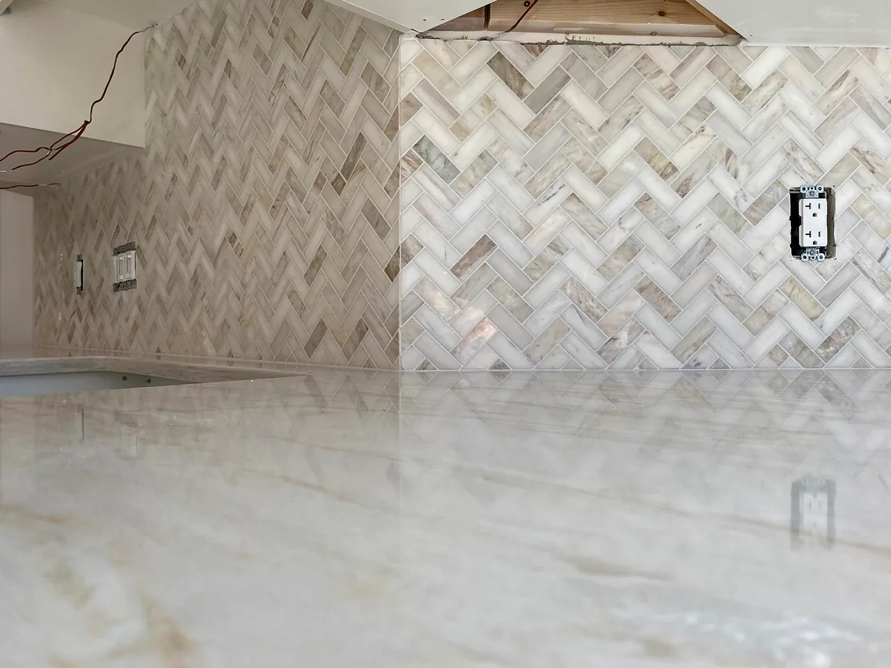 Marble herringbone above a marble counter