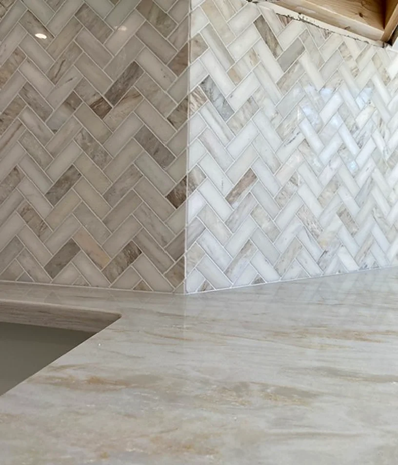 Marble herringbone above a marble counter