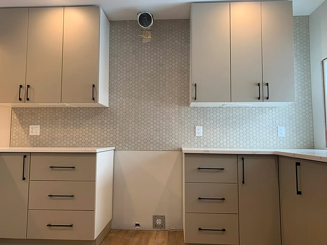 Penny mosaic up to the cabinets