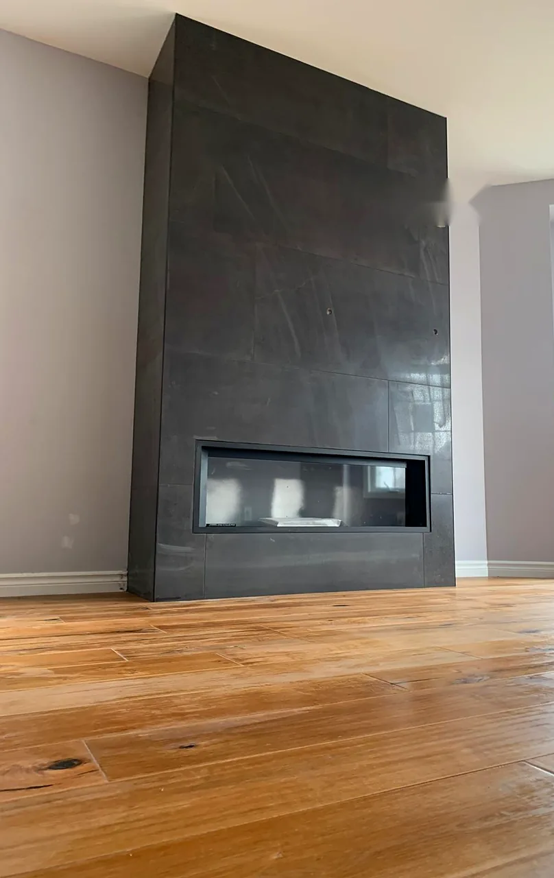 Slate slab around a linear fireplace